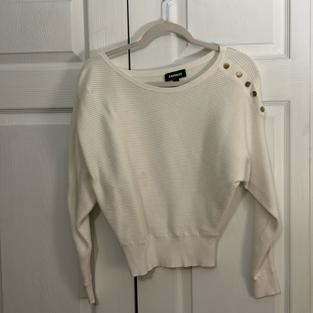 Cream colored sweater with gold detail